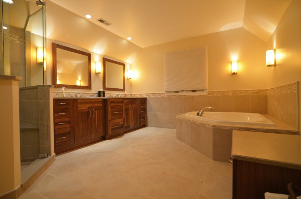 A master bathroom with warm finishes for a spa experience.