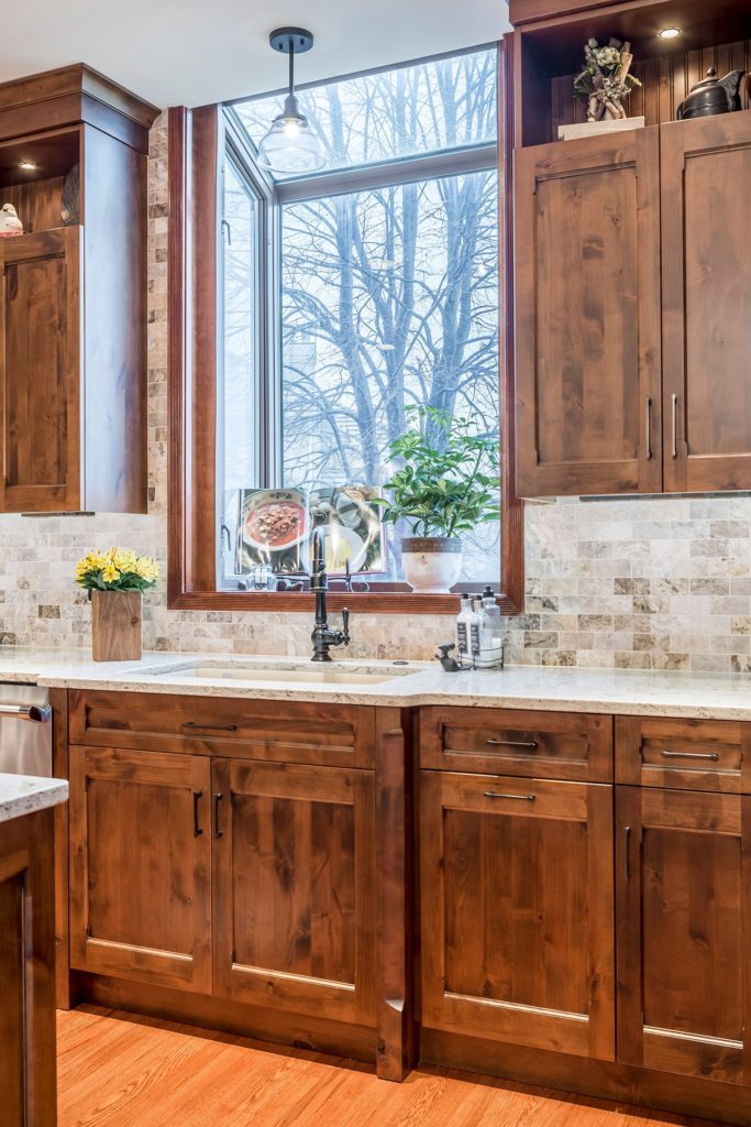Wood cabinets with light backsplash