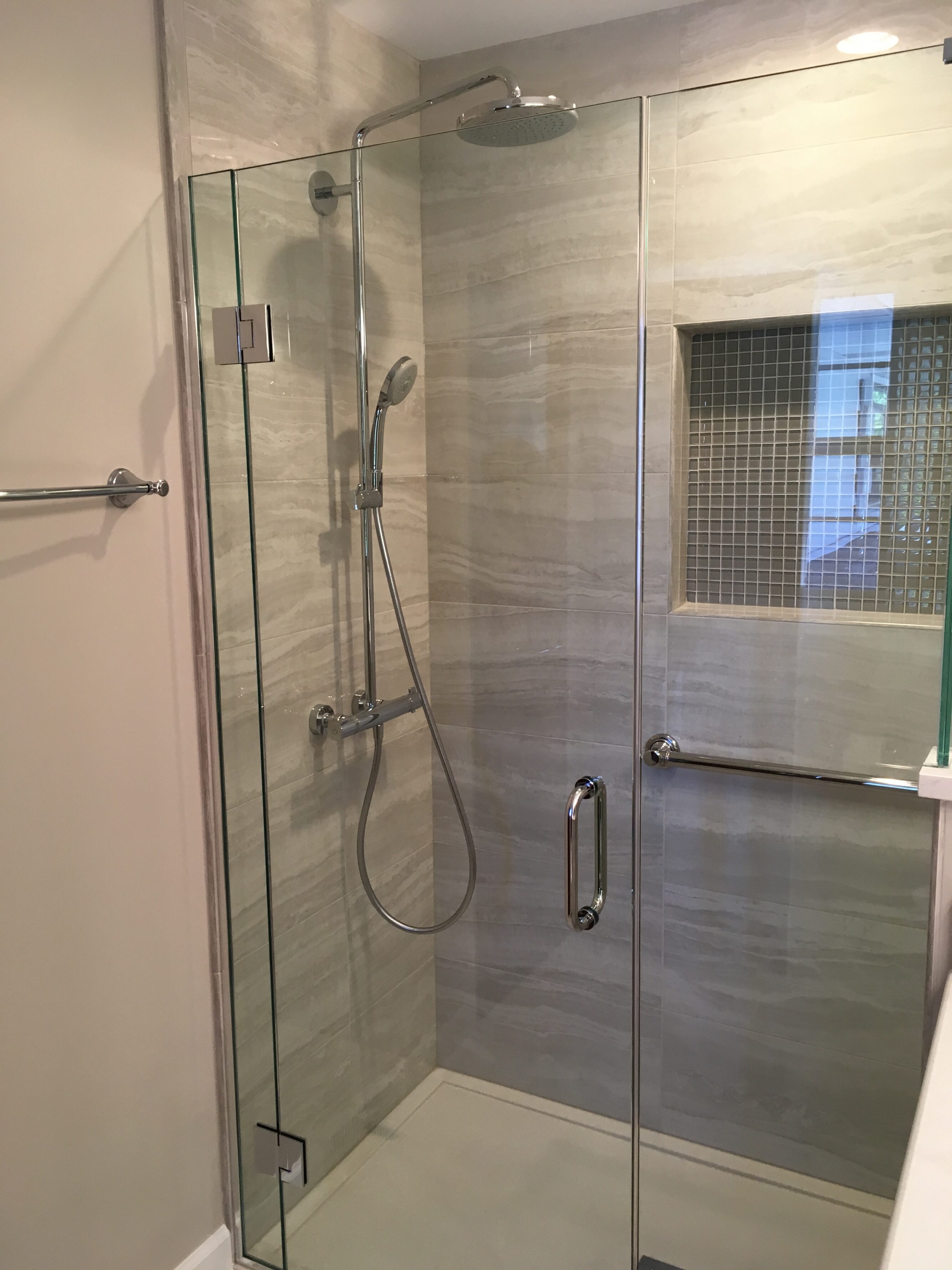 Marble shower by The Kitchen Master