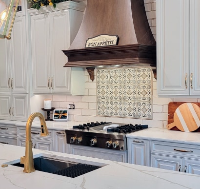 Kitchen remodel with large custom walnut kitchen hood