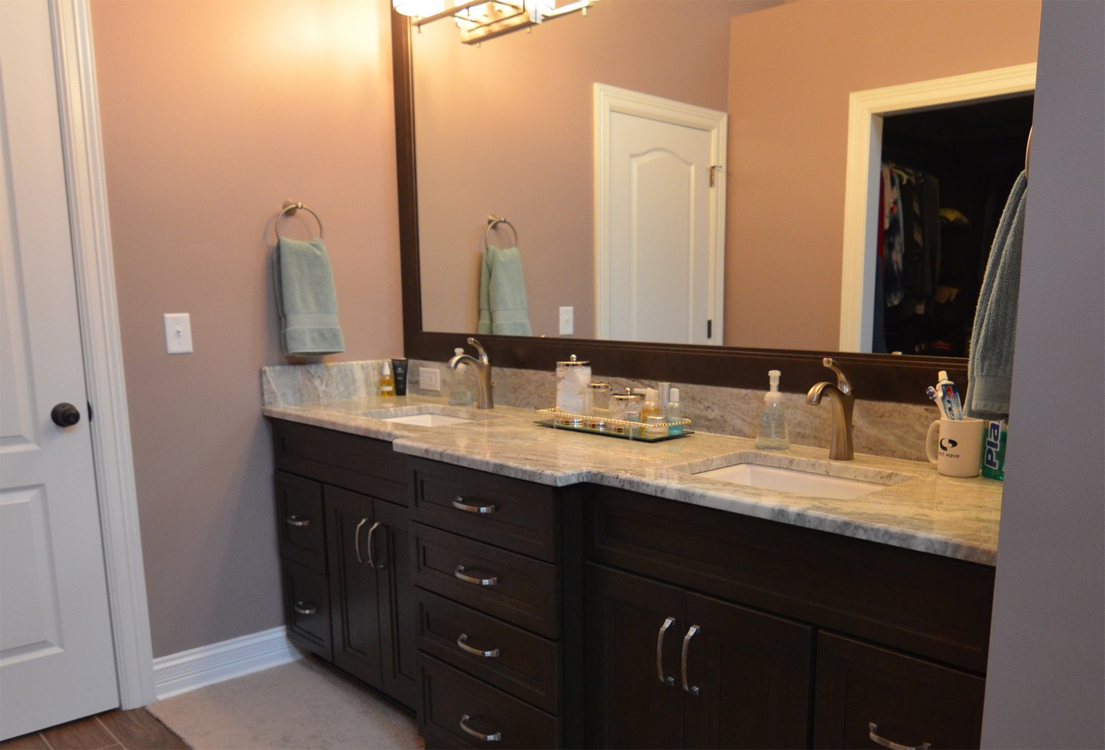 A custom bathroom remodeling that includes a vanity with oversized mirror