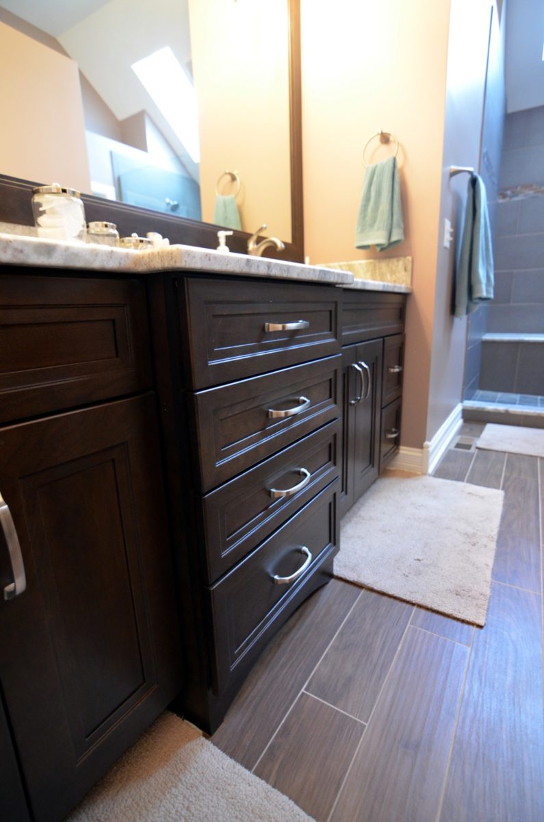 Bathroom remodeling in Naperville, IL. Vanity flooring detail in home bathroom.