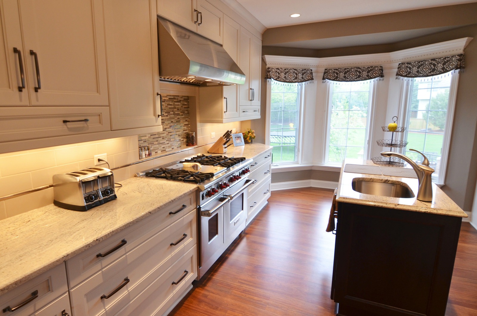 the kitchen master renovation galley kitchen white cabinets quartz countertops tall bay windows