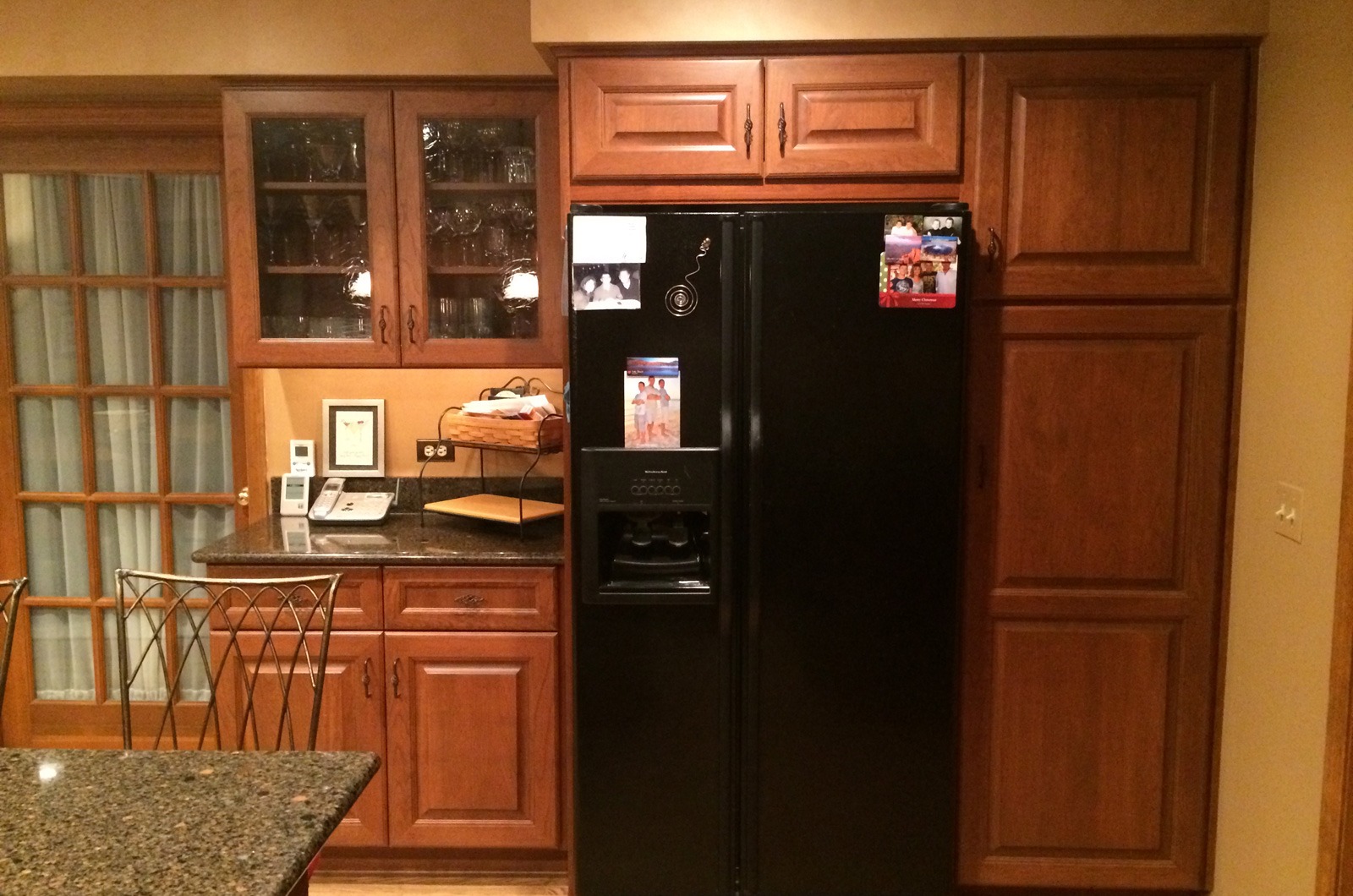 the kitchen master traditional remodel black fridge redwood cabinets