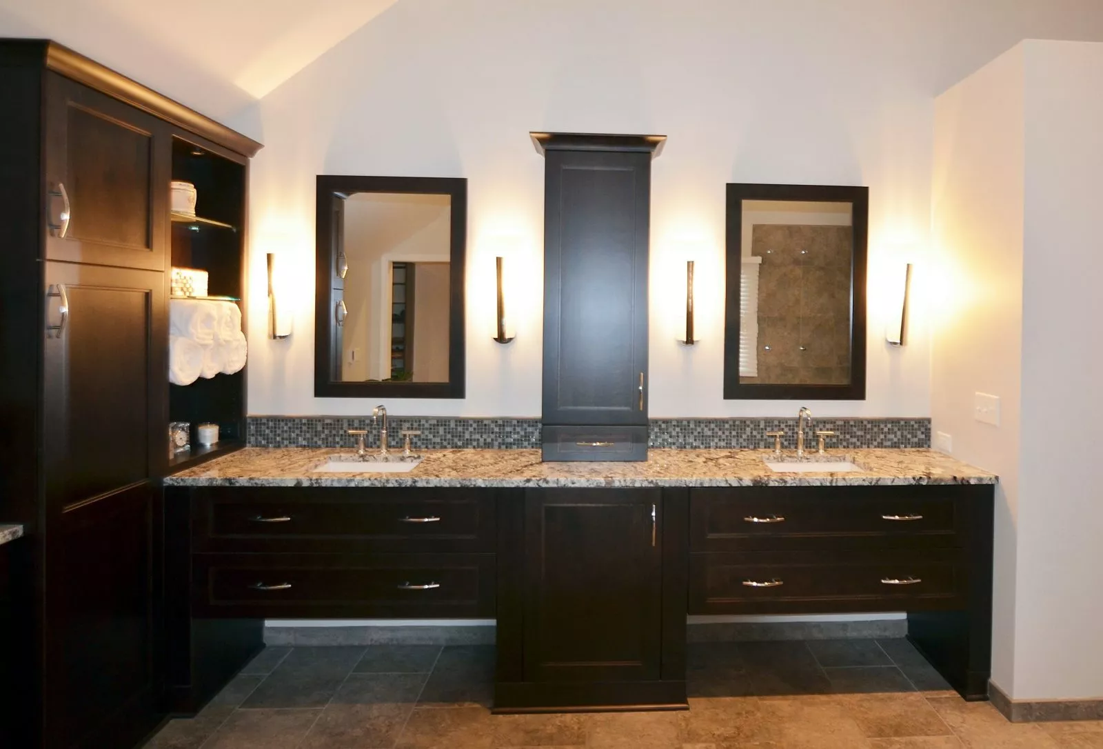 A suspended vanity adds modern flair to a kitchen while drawers for plumbing improve accessibility.