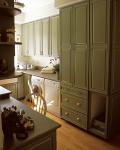 laundry room remodel floor to ceiling green cabinety from the kitchen master