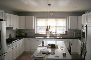 Tight traditional U-shaped kitchen before redesign.