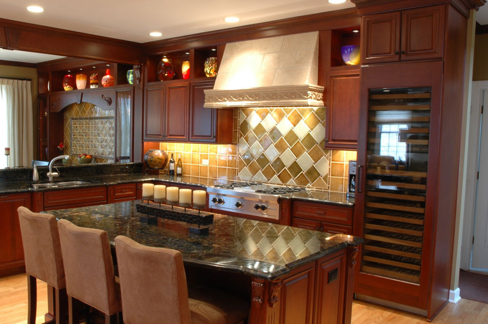 traditional kitchen renovation large wine fridge tile hooded vent marble island tile backsplash
