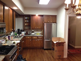the kitchen master before renovation black appliances light cabinets traditional