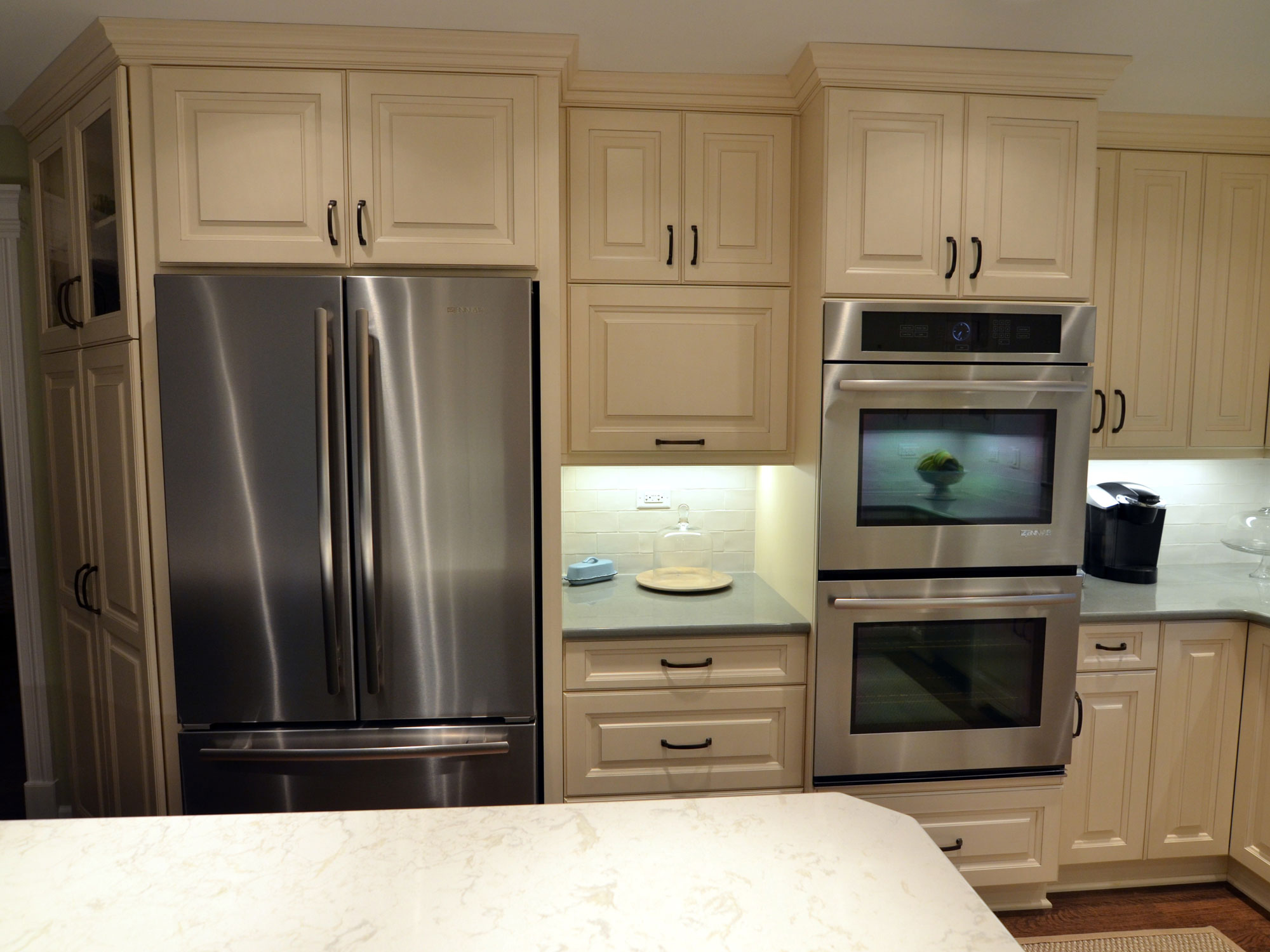 Kitchen remodeling in Naperville, IL. Home kitchen refrigerator and oven space after remodeling.