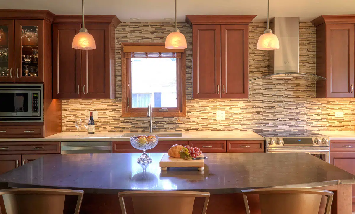 Kitchen with island, cabinets, drawers, appliances, sink and window