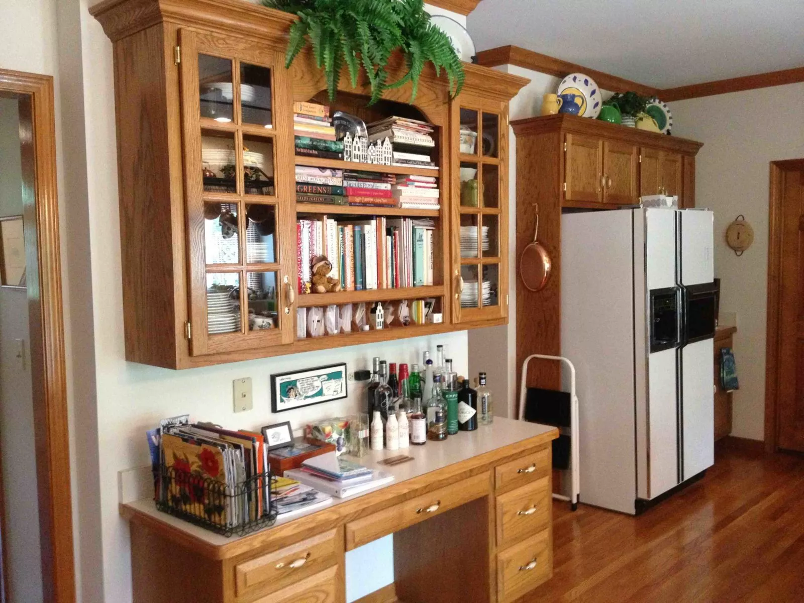 home kitchen design with custom cabinets and bookshelf