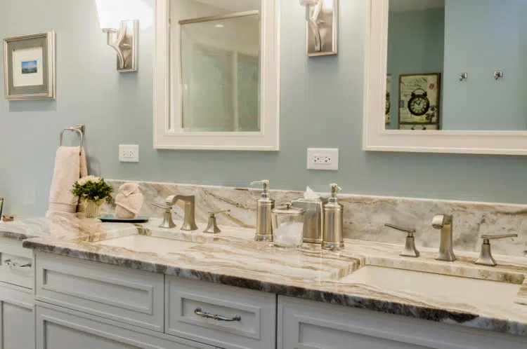 bathroom remodel light blue walls double mirrors 2 sink vanities chrome finishes