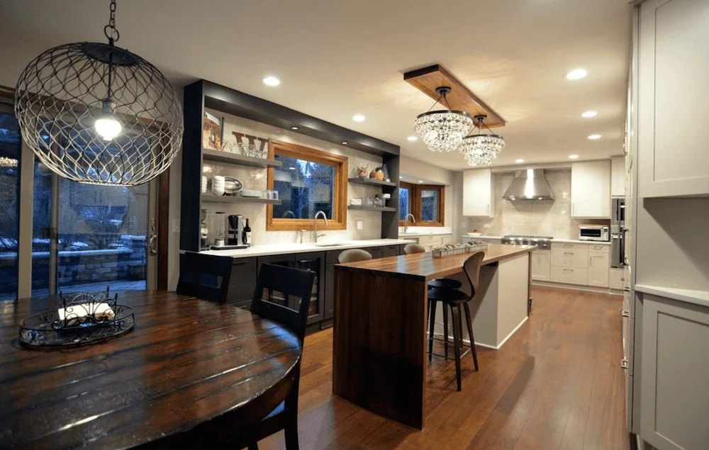 the kitchen master transitional kitchen large wooden island chandliers white & black cabinets