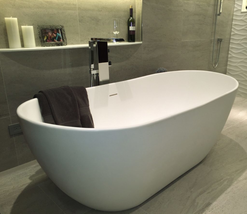White free-standing bath tub in a bathroom