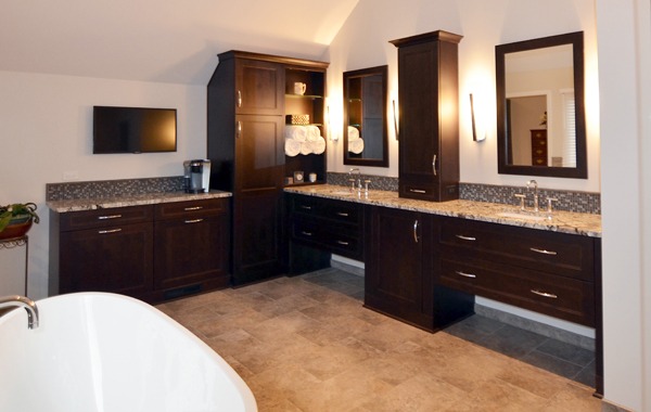 the kitchen master bathroom remodel L shaped vanity dark cabinetry double sink chrome finishes