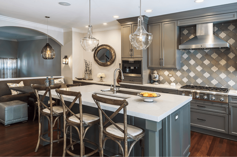 kitchen renovation tile backsplash large pendant lighting over marble island grey cabinetry