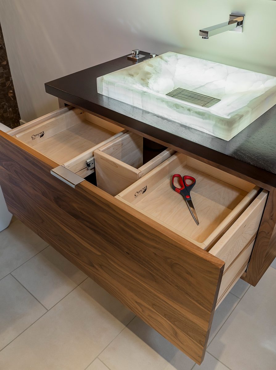 Quartz bathroom sink with lighting on the inside, with mirror and large open drawer underneath