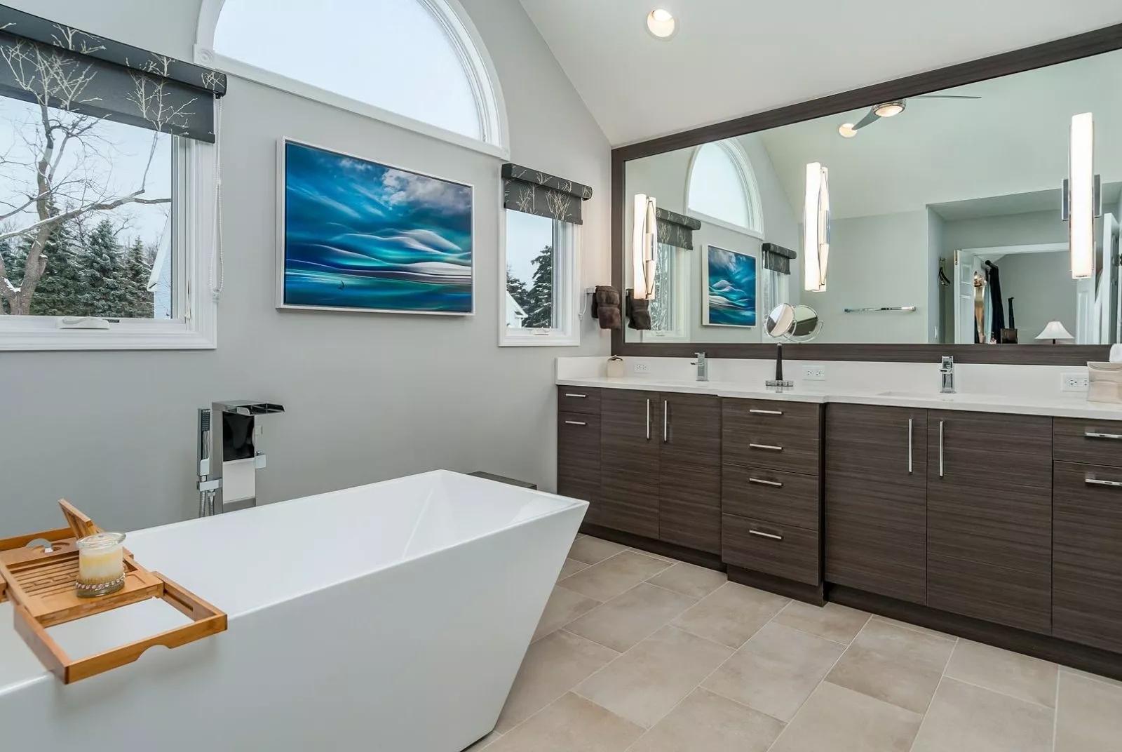 Bathroom grey grained cabinets large garden tub white countertop large vanity mirror vaulted ceiling