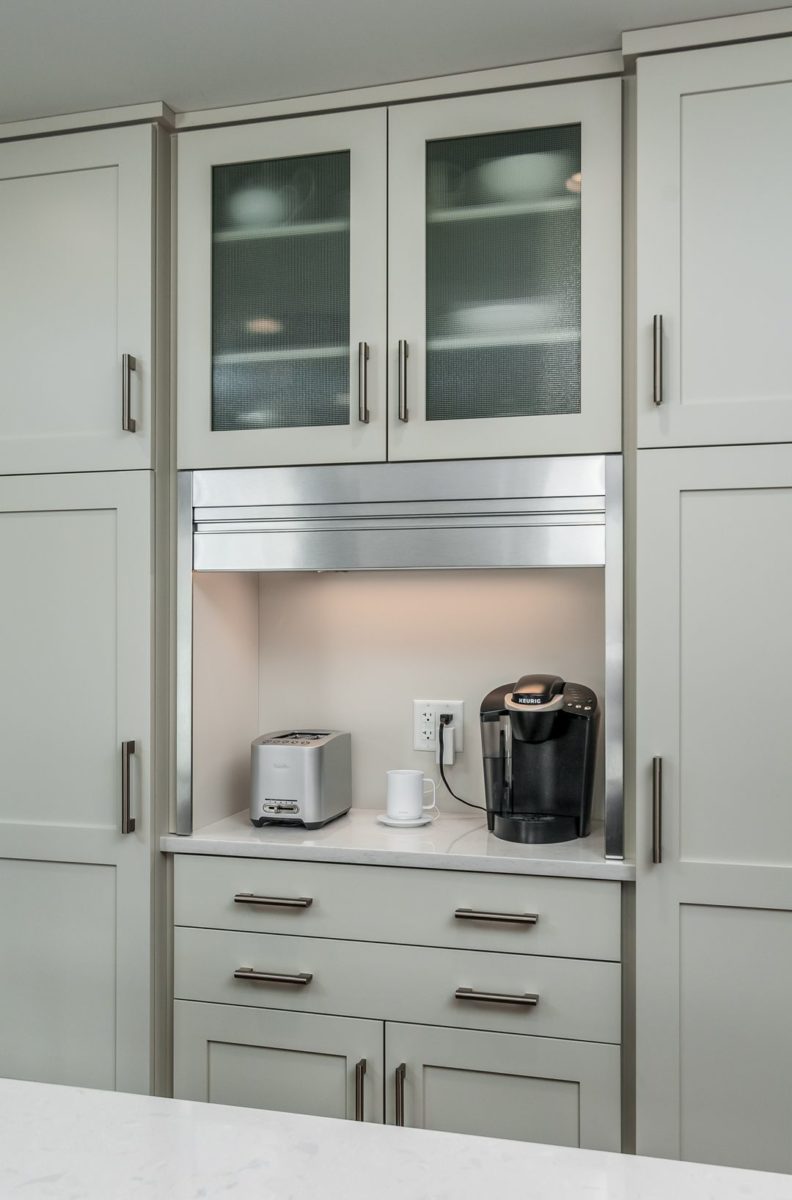 Kitchen counter nook with coffee maker and toaster, with metal shutter opened up