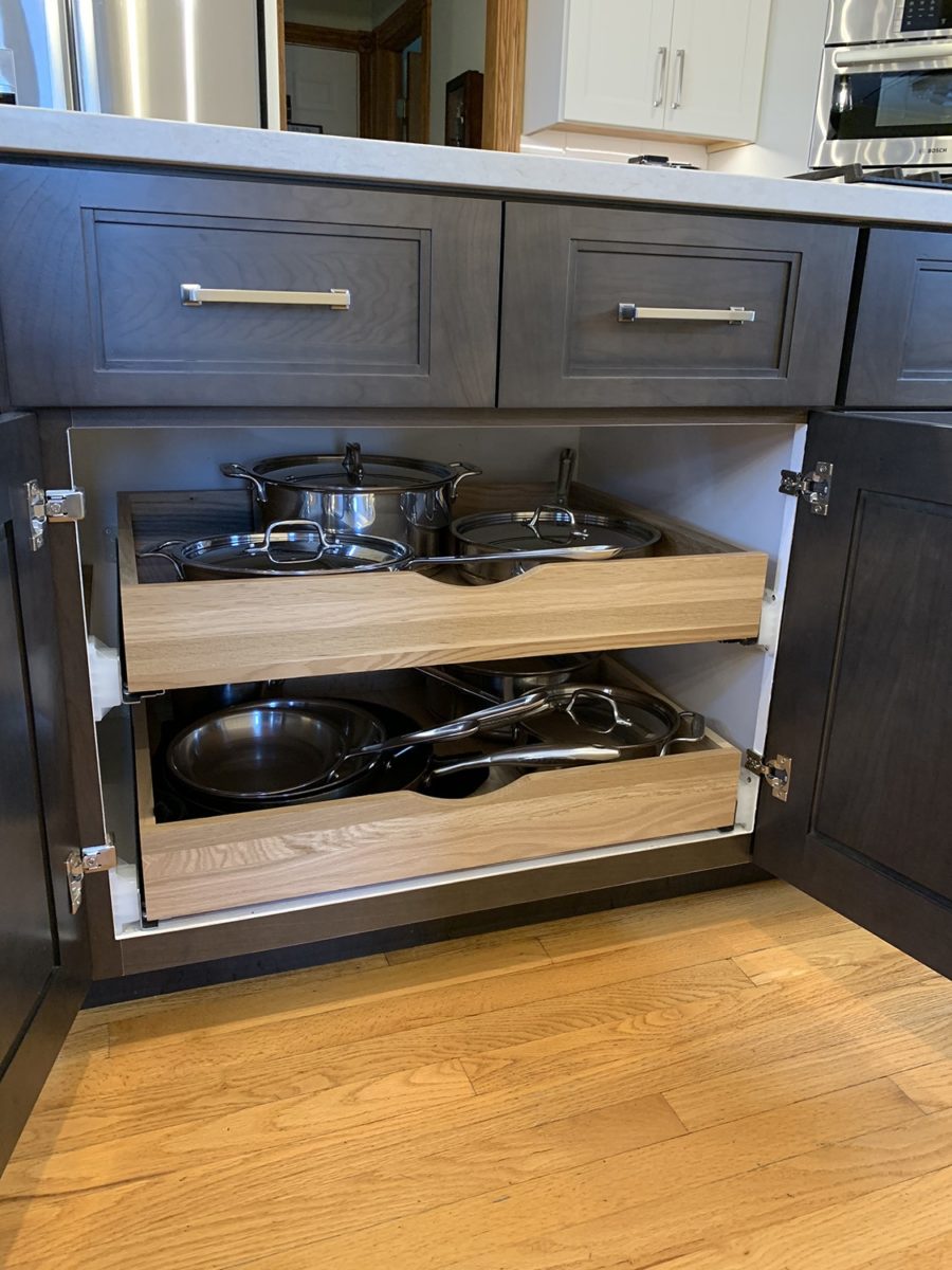 kitchen remodel open bottom cabinets pots and pans in drawers organized brown cabinets