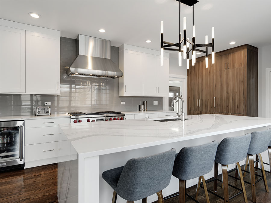 Modern kitchen with a large free-standing pantry containing cabinets and drawers