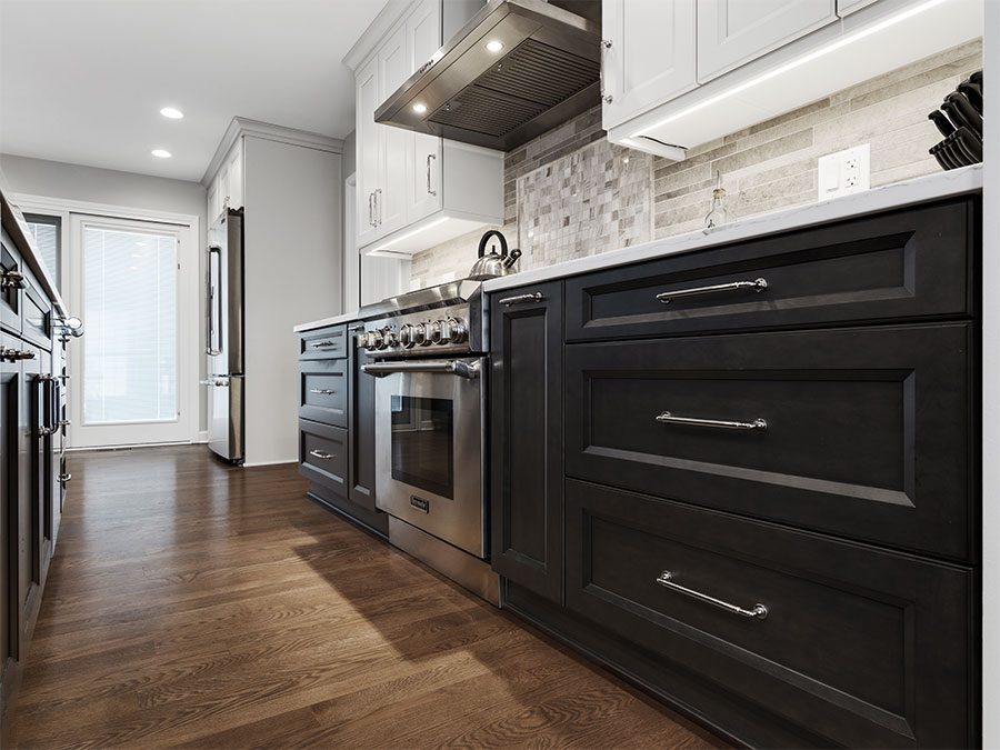 Modern kitchen with cabinets, drawers, refrigerator, oven and stove