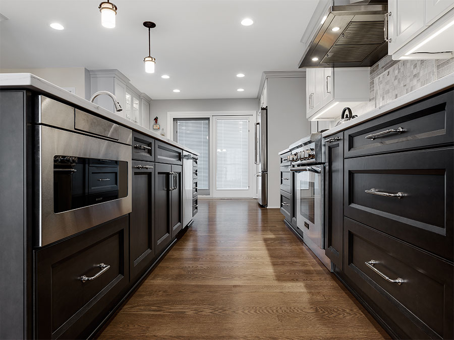 Modern kitchen with island, cabinets, drawers, sink and appliances