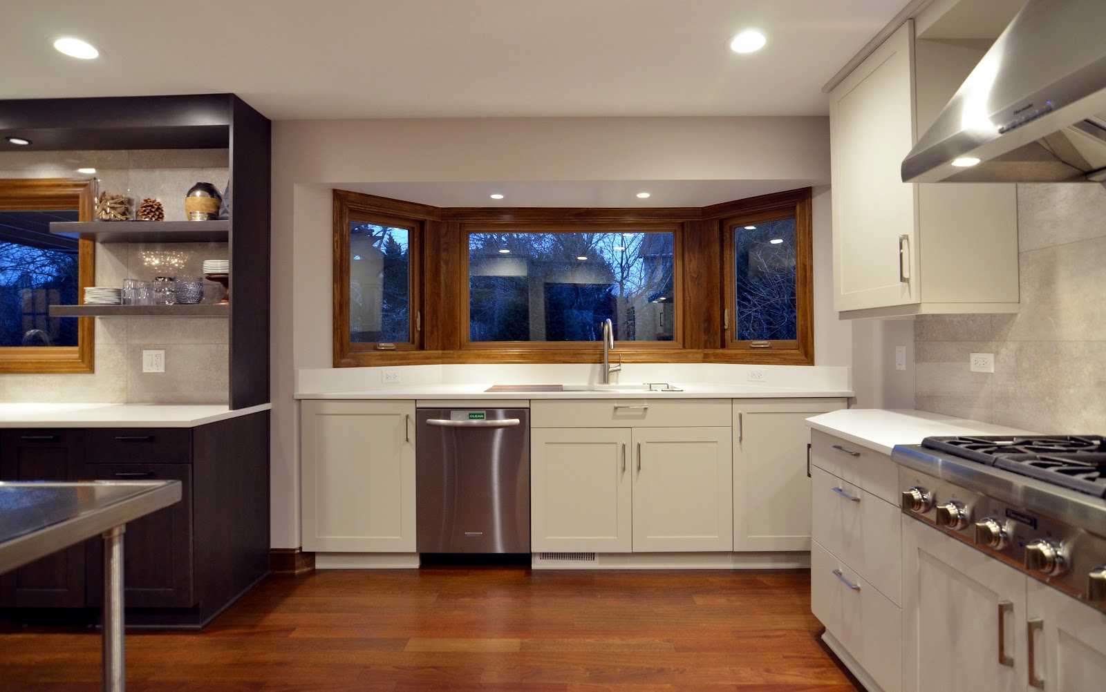 Kitchen with cabinets, sink, appliances, and windows