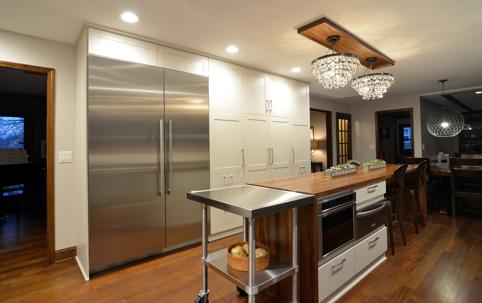 Kitchen and island with cabinets, furniture and appliances