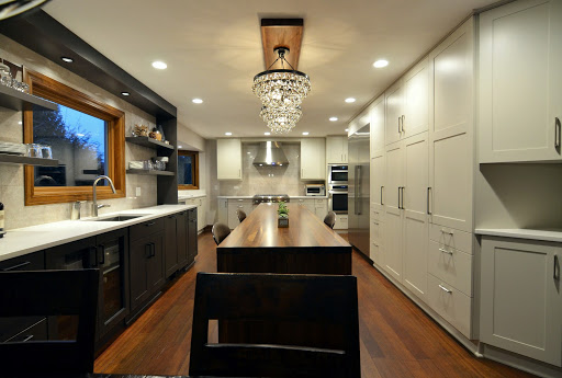 Kitchen connected to dining room with furniture and appliances