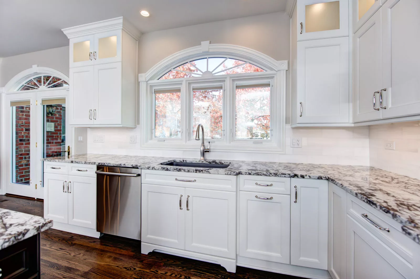 bright white kitchen renovation quartz countertops white cabinets chrome finishes