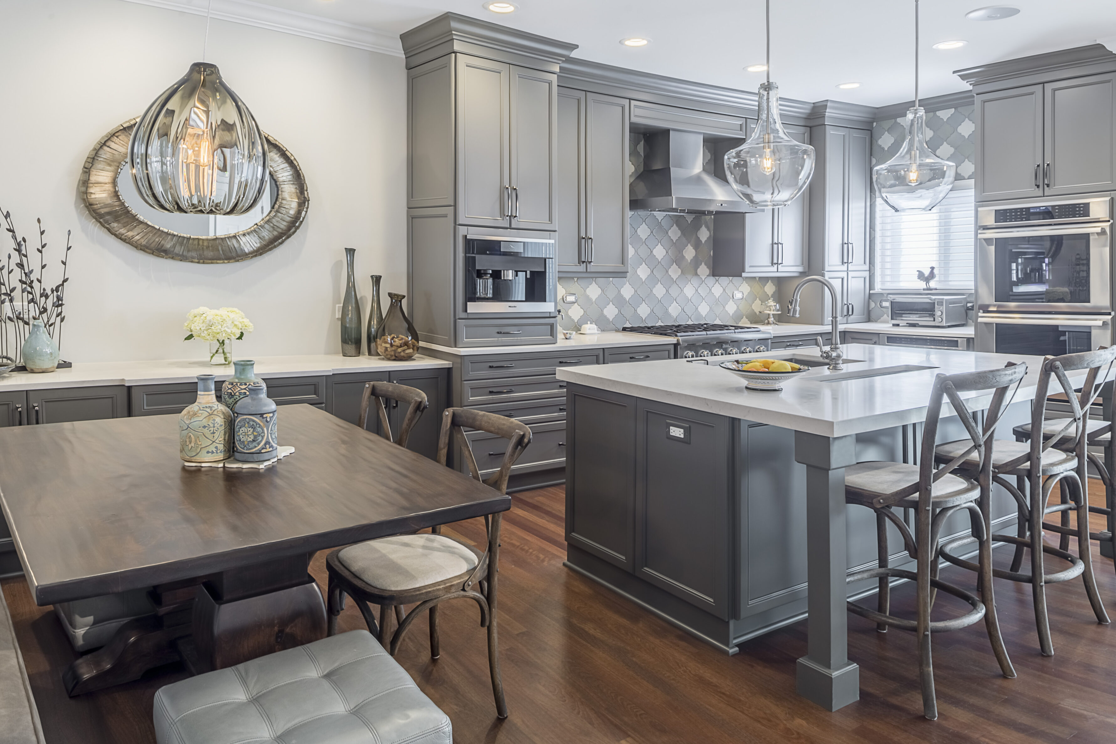 Gray and white remodeled kitchen by The Kitchen Master